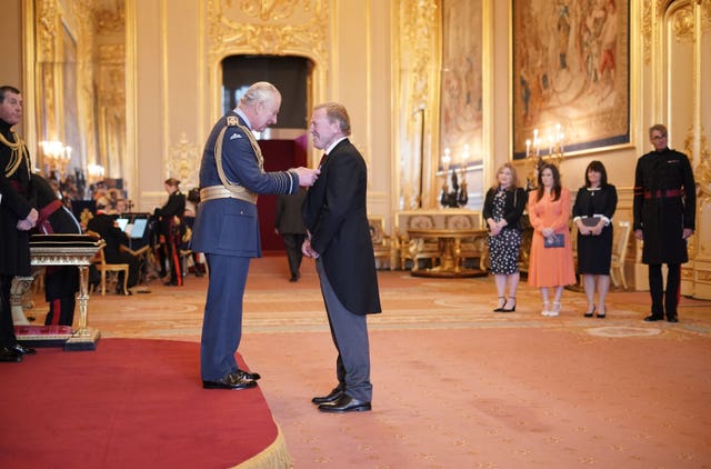 Morris is made a MBE by King Charles at Windsor Castle in November 2022