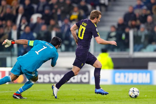 Harry Kane rounds Gianluigi Buffon before equalising