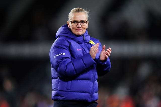 Sarina Wiegman applauds the England fans after victory over Australia