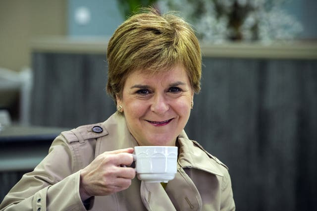 Nicola Sturgeon drinking a coffee