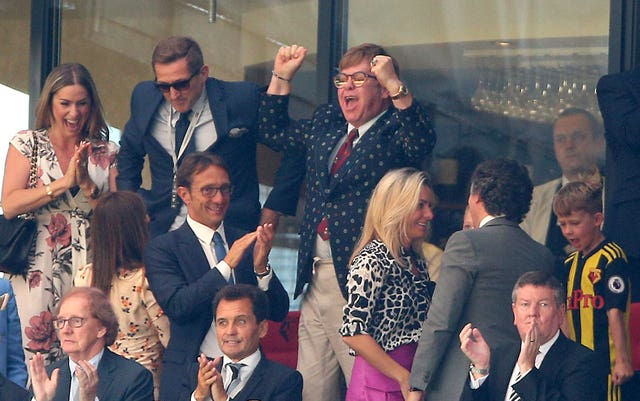 Former Watford owner Sir Elton John celebrated in the stands after the win over Tottenham (Nigel French/PA).