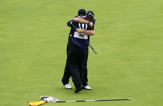 Shane Lowry celebrates winning the Claret Jug with caddie Bo Martin