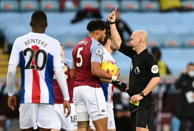 Aston Villa’s Tyrone Mings is shown a red card