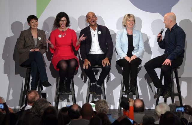 Politicians Caroline Lucas, left, Layla Moran, Chuka Umunna, and Anna Soubry joined onstage by comedian Andy Parsons, right, during the People's Vote campaign launch (Jonathan Brady/PA)