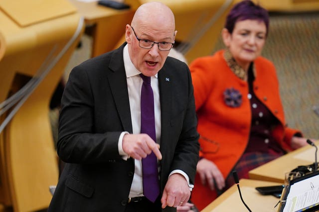 John Swinney pointing while speaking during FMQs