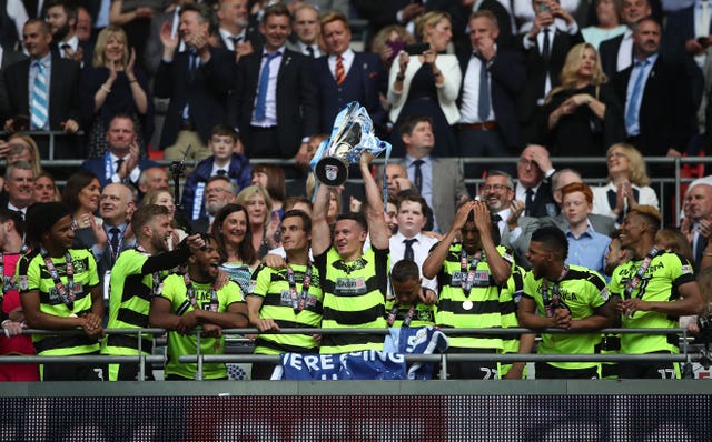 Jonathan Hogg, raising trophy, hopes to celebrate another Premier League promotion with Huddersfield