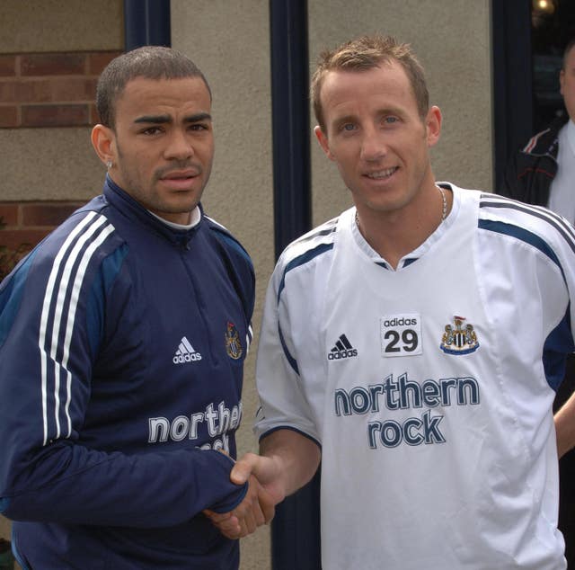 Kieron Dyer, left, and Lee Bowyer shake hands after their on-pitch brawl
