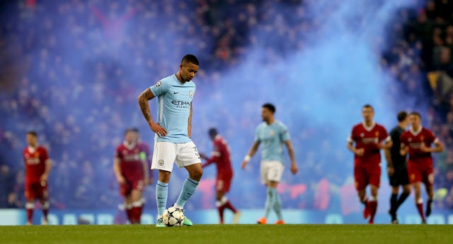 Manchester City players look dejected after Liverpool score in their Champions League match. (PA)