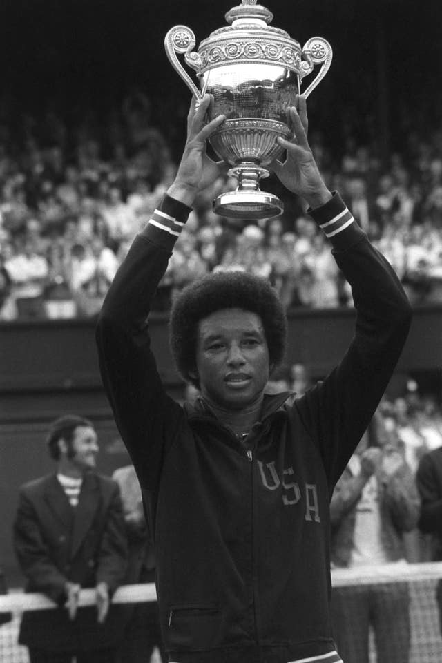 Arthur Ashe lifts the Wimbledon trophy in 1975