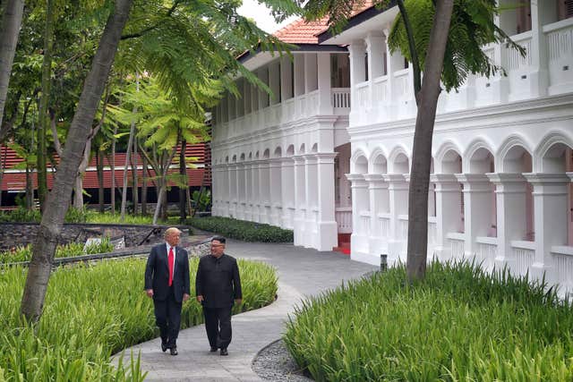 Donald Trump and Kim Jong Un during their first summit in Singapore (Kevin Lim/The Straits Times/PA)