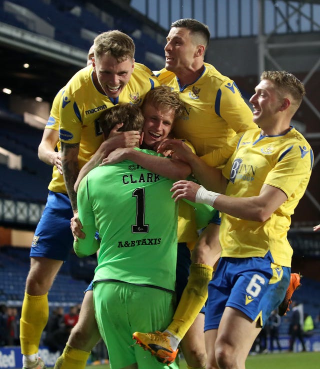 St Johnstone players swamp goalkeeper Zander Clark after his Ibrox heroics