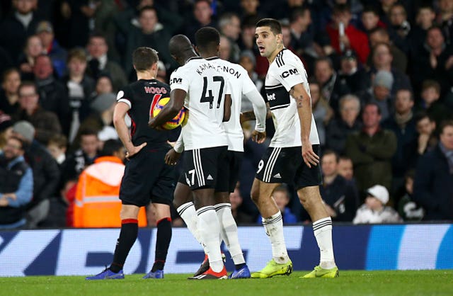 Kamara tussled with team-mates to take a penalty in the recent game against Huddersfield.