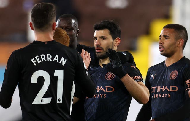 Sergio Aguero (centre) celebrates scoring