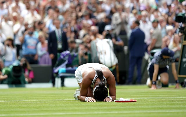 Heather Watson falls to the turf after finally securing her victory