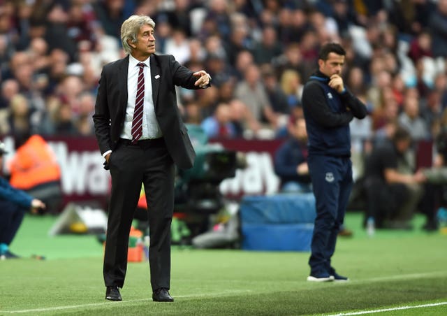 West Ham boss Manuel Pellegrini (left) saw his side overtaken in the table by Marco Silva's Everton