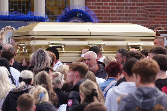 The coffin is carried into St Michael the Archangel Church in Athy for the funeral of Joe Carthy