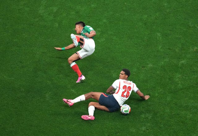 England’s Jarell Quansah, right, fouls Mexico’s Jesus Gallardo