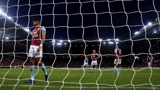 Tyrone Mings looks dejected after the last-gasp defeat 