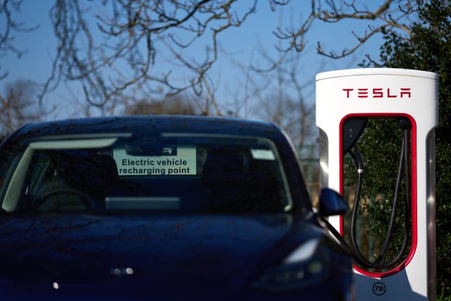 A Tesla vehicle being charged