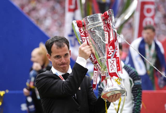 Sunderland head coach Regis Le Bris lifts the trophy following the Sky Bet Championship play-off final