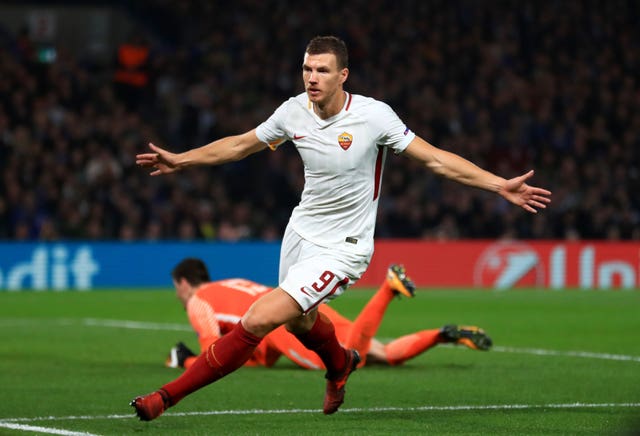 Roma's Edin Dzeko will be looking to capitalise on any defensive weakness by Liverpool .