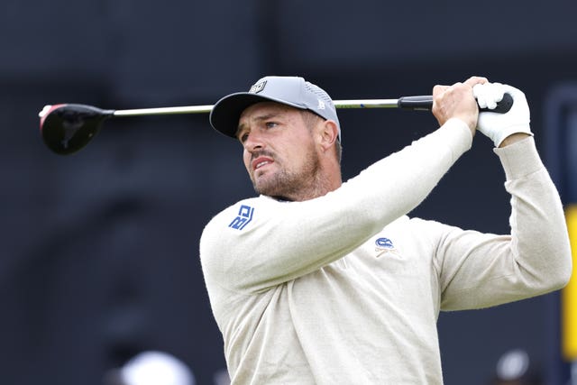 Bryson DeChambeau watches his shot