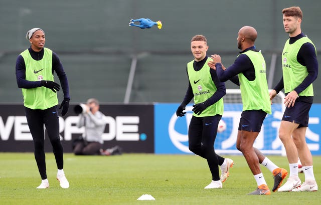 England players play with a rubber chicken during the training session at the Spartak Zelenogorsk Stadium