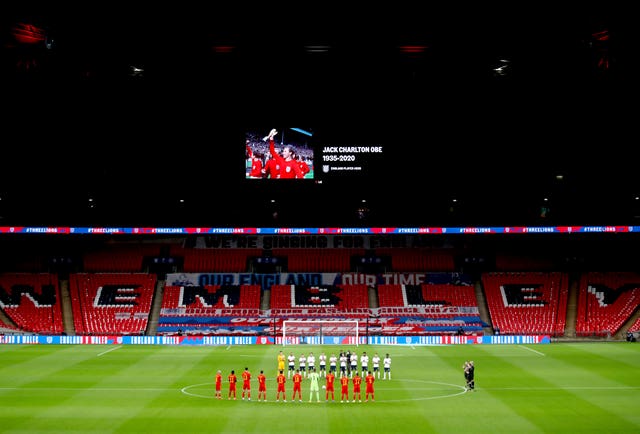 Players from England and Wales take part in a minute's applause in memory of footballers and fans who died this year ahead of an international friendly at Wembley in October. World Cup winners Norman Hunter, Jack Charlton, Nobby Stiles, Diego Maradona and Paolo Rossi are among the ex-footballers to have died during 2020. England won the match 3-0 thanks to goals from Dominic Calvert-Lewin, Conor Coady and Danny Ings