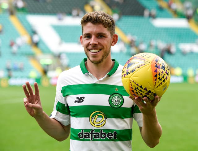 Ryan Christie celebrates with the match ball after his hat-trick