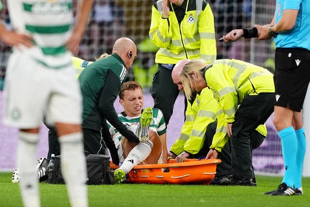 Celtic’s Alistair Johnston is placed on to a stretcher by medical staff