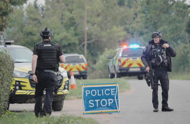 A police checkpoint, with two armed officers