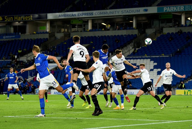 Bernardo, fourth right, heads in Brighton's third