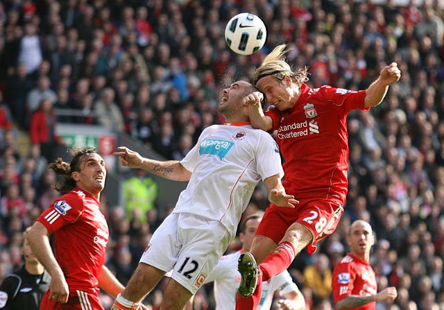 Christian Poulsen, right, made 12 appearances for Liverpool during the 2010/11 season
