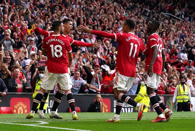 Cristiano Ronaldo, second left, celebrates his first goal