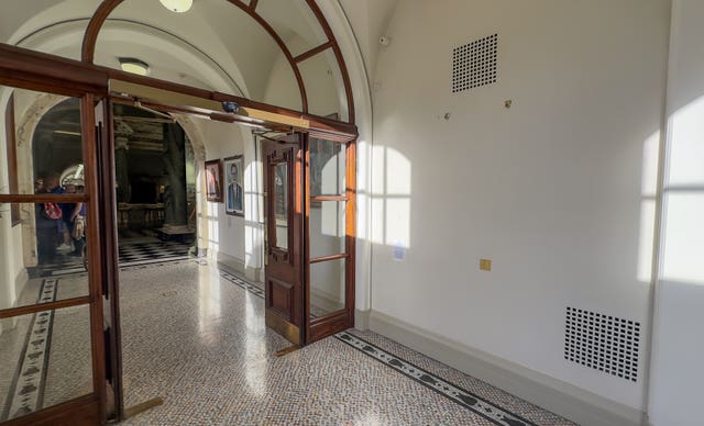 A wall with a space for a portrait