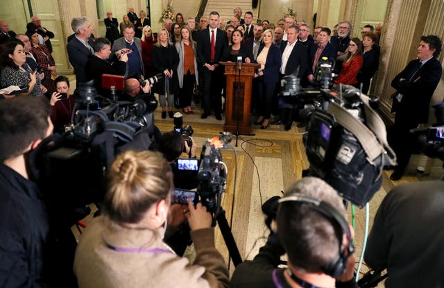 Sinn Fein president Mary Lou McDonald (centre), and deputy leader Michelle O’Neill (centre right) with party colleagues speak to the media at Stormont