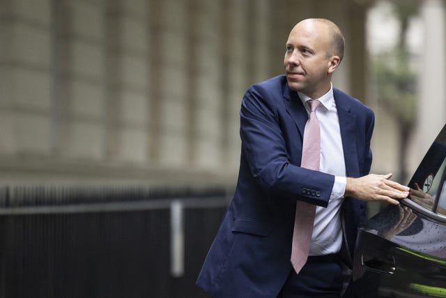 Matt Hancock steps out of a car