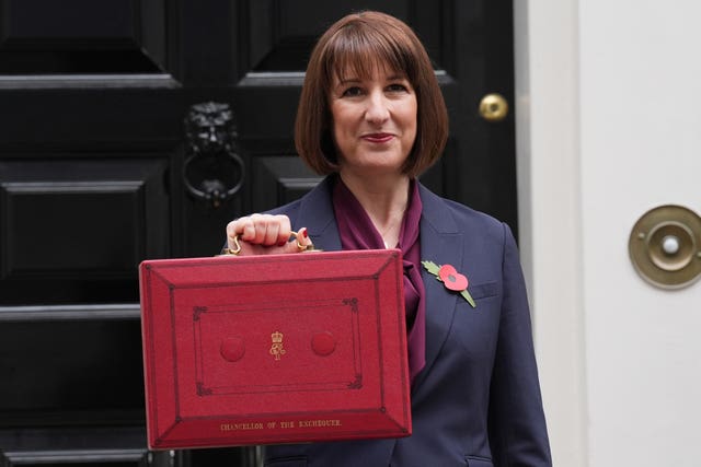 Chancellor of the Exchequer Rachel Reeves presses red Budget case in front of 11 Downing Street