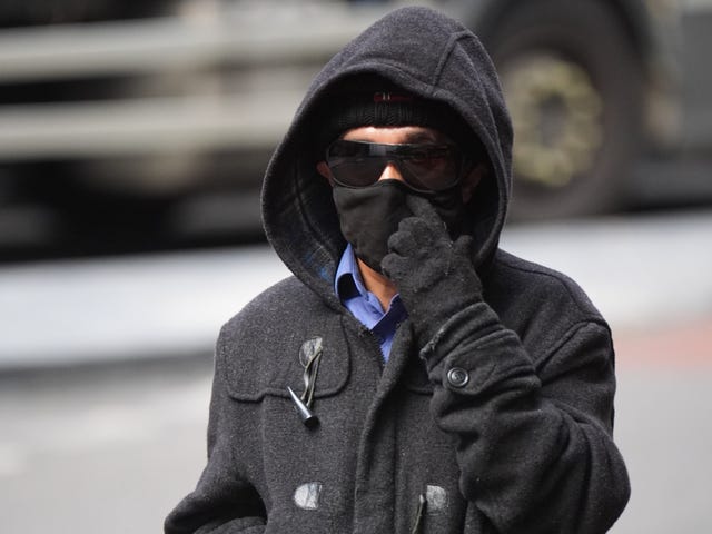 Kashim Chowdhury in mask, hood and sunglasses