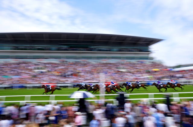 Totally Charming and William Buick (left) win the World Pool Handicap