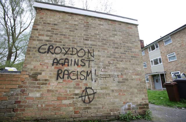 Graffiti reading 'Croydon Against Racism' near to the scene where teenage asylum seeker Kurdish Iranian Reker Ahmed was left fighting for his life after a suspected hate attack in Croydon, south London (Yui Mok/PA)