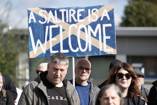 People take part in a Stand Up To Racism counter protest outside the Cladhan Hotel in Falkirk, which is housing asylum seekers