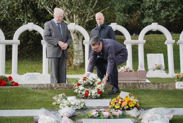 Andy Burnham laying a wreath at Aberfan