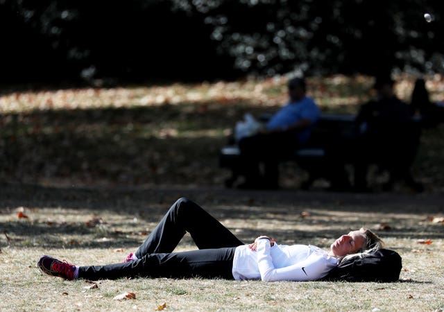 Sun worshippers visit Green Park, London