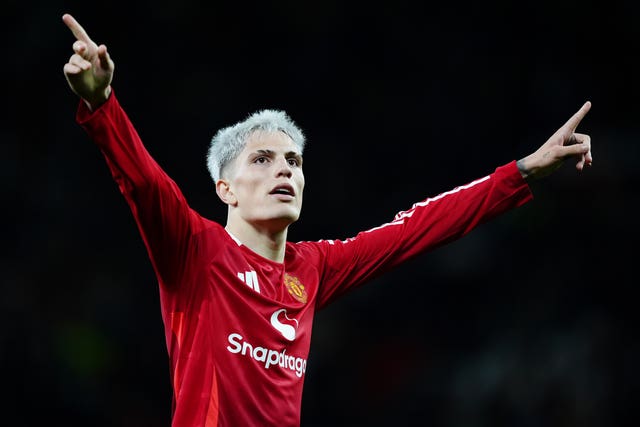 Alejandro Garnacho puts both hands in the air to salute the Old Trafford crowd in Manchester United''s win over Barnsley