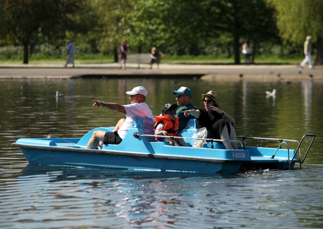 Some people took to a pedalo on Regent’s Park lake in an effort to cool down (Yui Mok/PA)