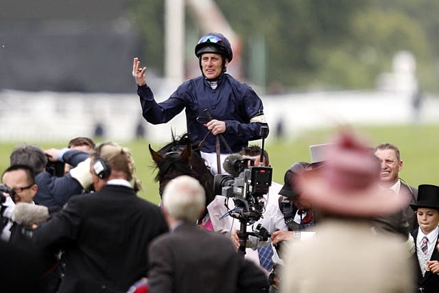Johnny Murtagh salutes the crowd after Yeats wins his fourth Gold Cup