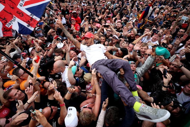 Lewis Hamilton celebrates his victory with the crowd after the British Grand Prix at Silverstone in 2019