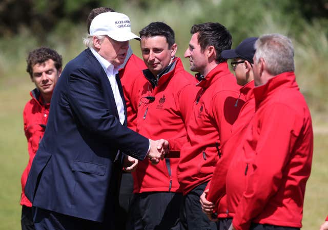 Donald Trump meets staff during a visit to his course at Balmedie (Andrew Milligan/PA)