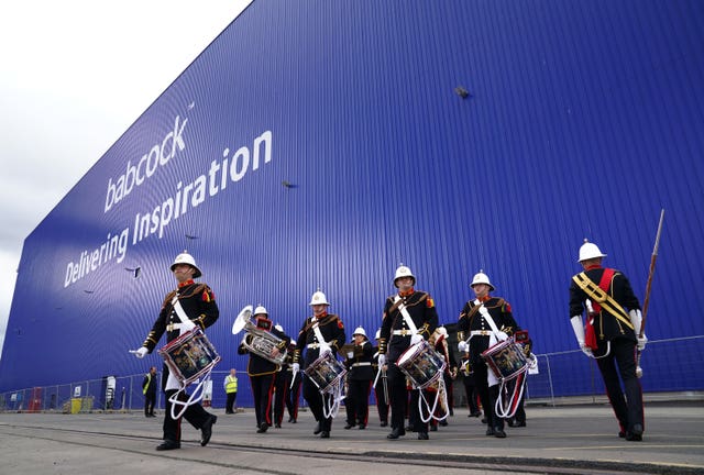 The Royal Marine Band leave The Venturer Building after a frigate steel cutting ceremony for the first of the class Type 31 frigate, at Babcock Rosyth, Fife
